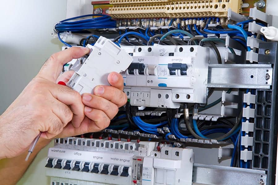 PULSE ELECTRICAL TECHNICIAN WORKING ON AN ELECTRICAL PANEL